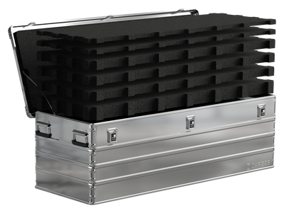 ZARGES K470-40875 case open with stacked layers of black pick-and-pluck foam rising out of the base