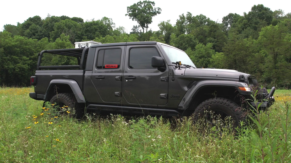 ZARGES roof rack mounting hardware being fitted to a case on a Jeep Gladiator rack