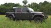 ZARGES roof rack mounting hardware being fitted to a case on a Jeep Gladiator rack