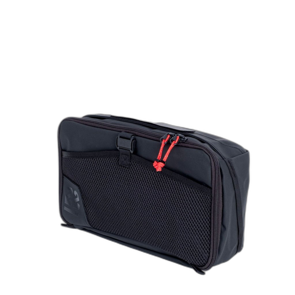 Step 22 Quoll Cube HD Packing Cube, Small, black with mesh front pocket and red zipper pulls, angled view