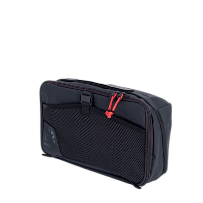 Step 22 Quoll Cube HD Packing Cube, Small, black with mesh front pocket and red zipper pulls, angled view