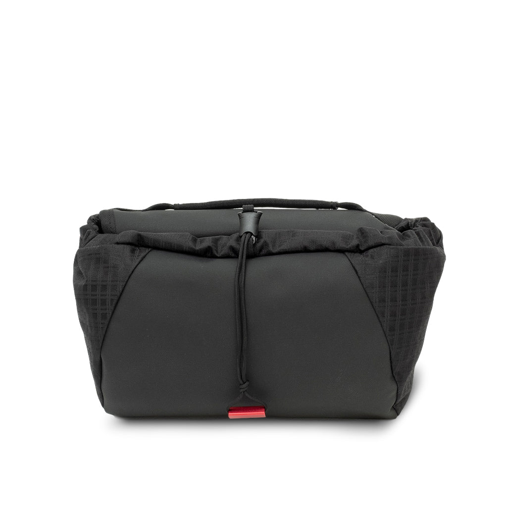 Step 22 Hedgehog Toiletry Roll, black, rolled closed, front view with drawstring and top handle