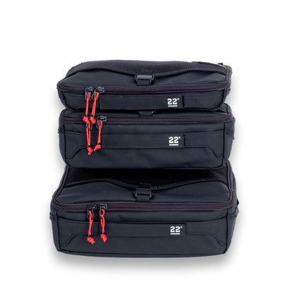 Step 22 Quoll Cube HD packing cubes stacked three high, zippered fronts and 22° logos facing forward