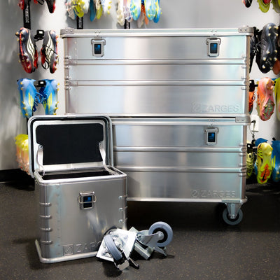 ZARGES Caster Storage Case open beside two large ZARGES cases, one on casters, in a cleat-lined shop