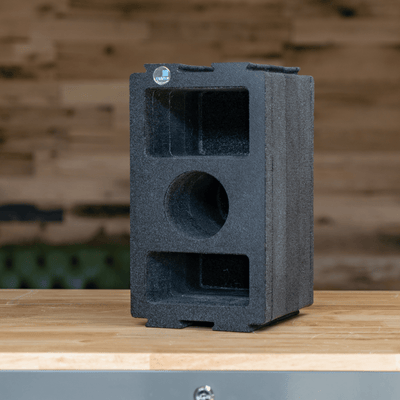 ZARGES Chameleon Module - Double Wide Camera upright on a wooden counter against a plank wall