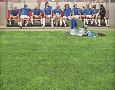 Soccer team on the bench with an open ZARGES K424 XC-41812 case at the edge of the pitch