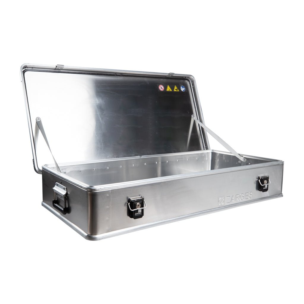 ZARGES K470-380031 case with lid open, empty interior and safety labels inside the lid