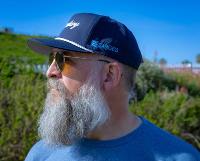 ZARGES Legendary Navy Blue Rope Hat in left profile on a bearded man, blue ZARGES logo on the side panel