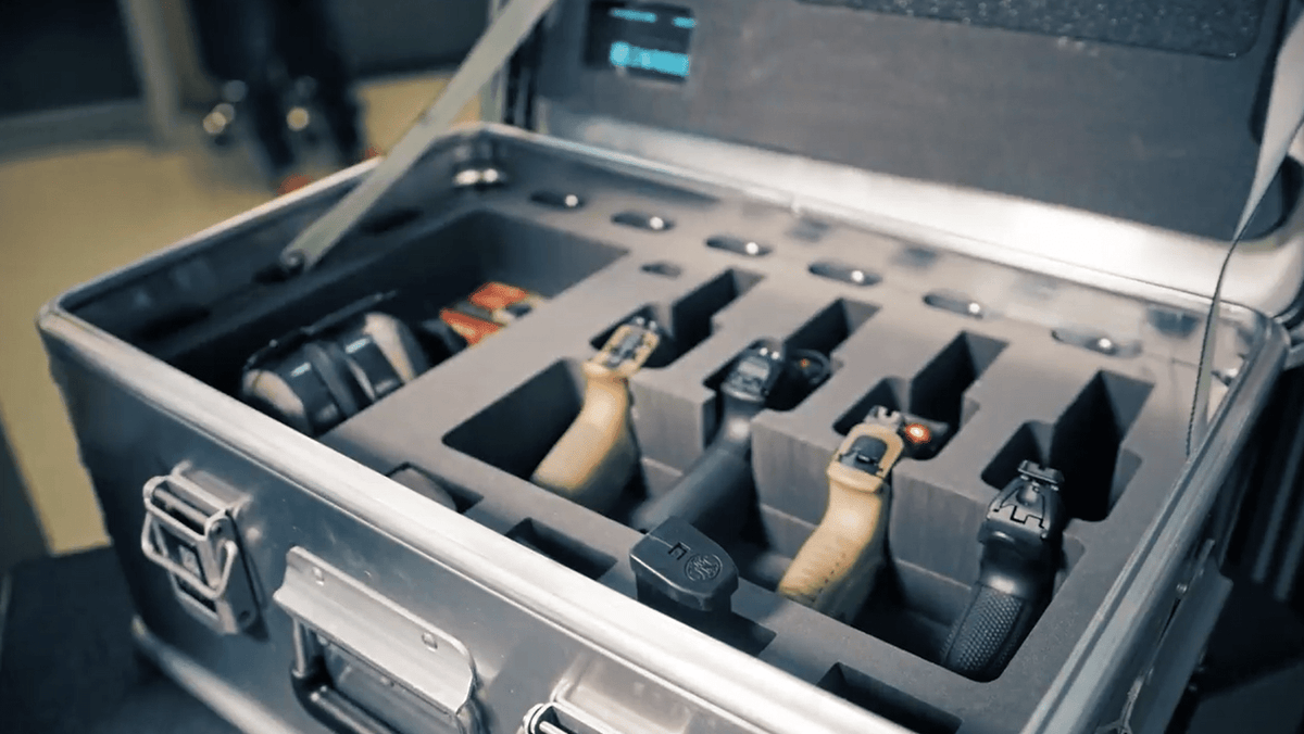 ZARGES PistolPak Case open with handguns and magazines seated upright in the foam insert