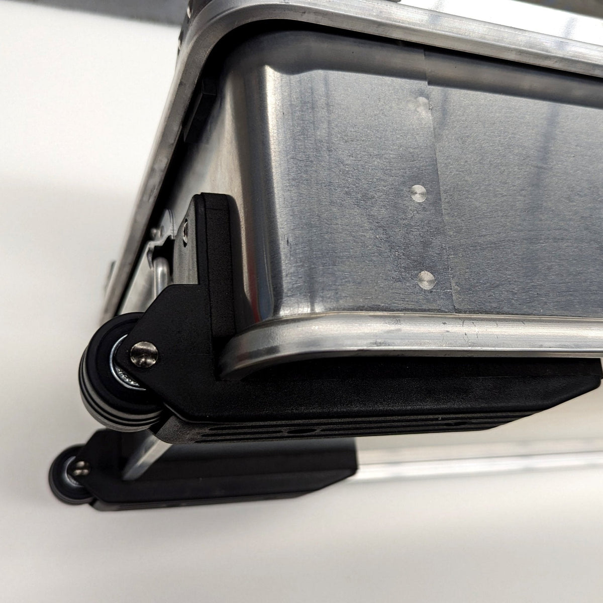 ZARGES Wheel Set fitted to the bottom edge of an aluminum case, close-up of the wheels