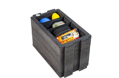 ZARGES Chameleon Module - Double Wide with Dividers lying flat, compartments holding small gear and hand warmers